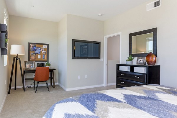 Luxury bedroom with modern decor at Salerno Apartments featuring spacious layout and elegant furnishings suitable for urban living