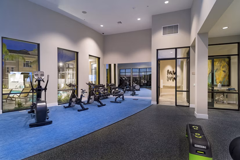 Fitness center equipped with modern exercise machines at Salerno Apartments