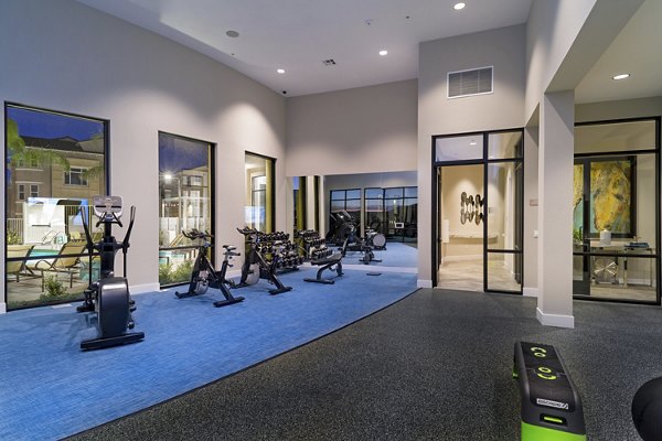 Fitness center equipped with modern exercise machines at Salerno Apartments