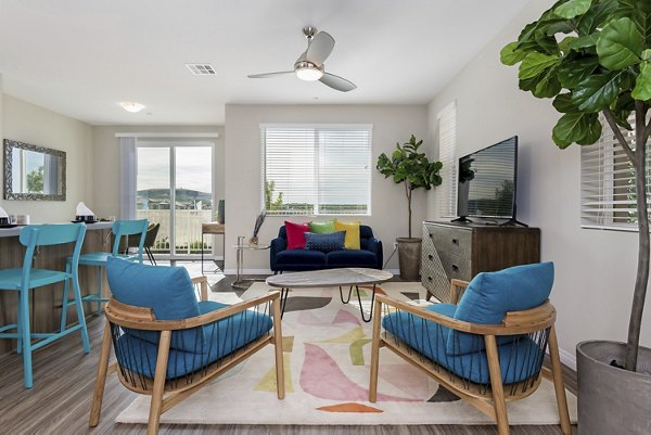 Modern living room with elegant furnishings at Salerno Apartments, a Greystar luxury community