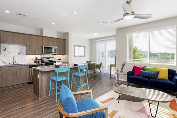Spacious living room with modern decor and natural light in Salerno Apartments Perfect for relaxation and entertaining in a luxury setting