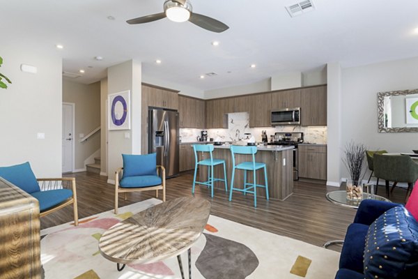 Spacious living room with modern decor and natural light at Salerno Apartments