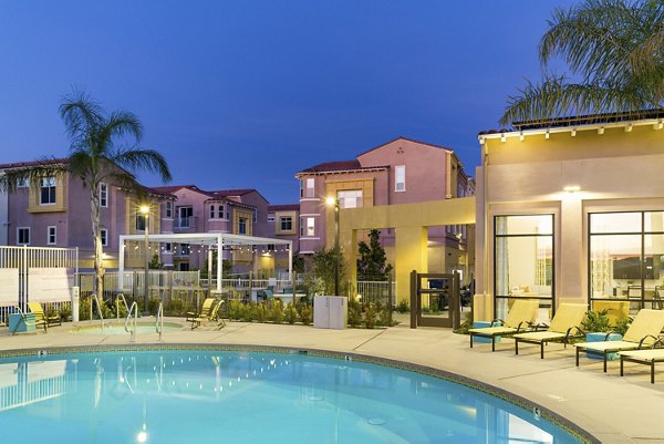 Resort-style pool area with palm trees at Salerno Apartments offering luxury amenities in Miami