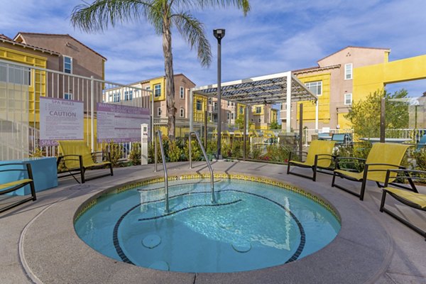Hot tub at Salerno Apartments: Relaxing outdoor jacuzzi surrounded by lush landscaping Perfect for unwinding after a long day