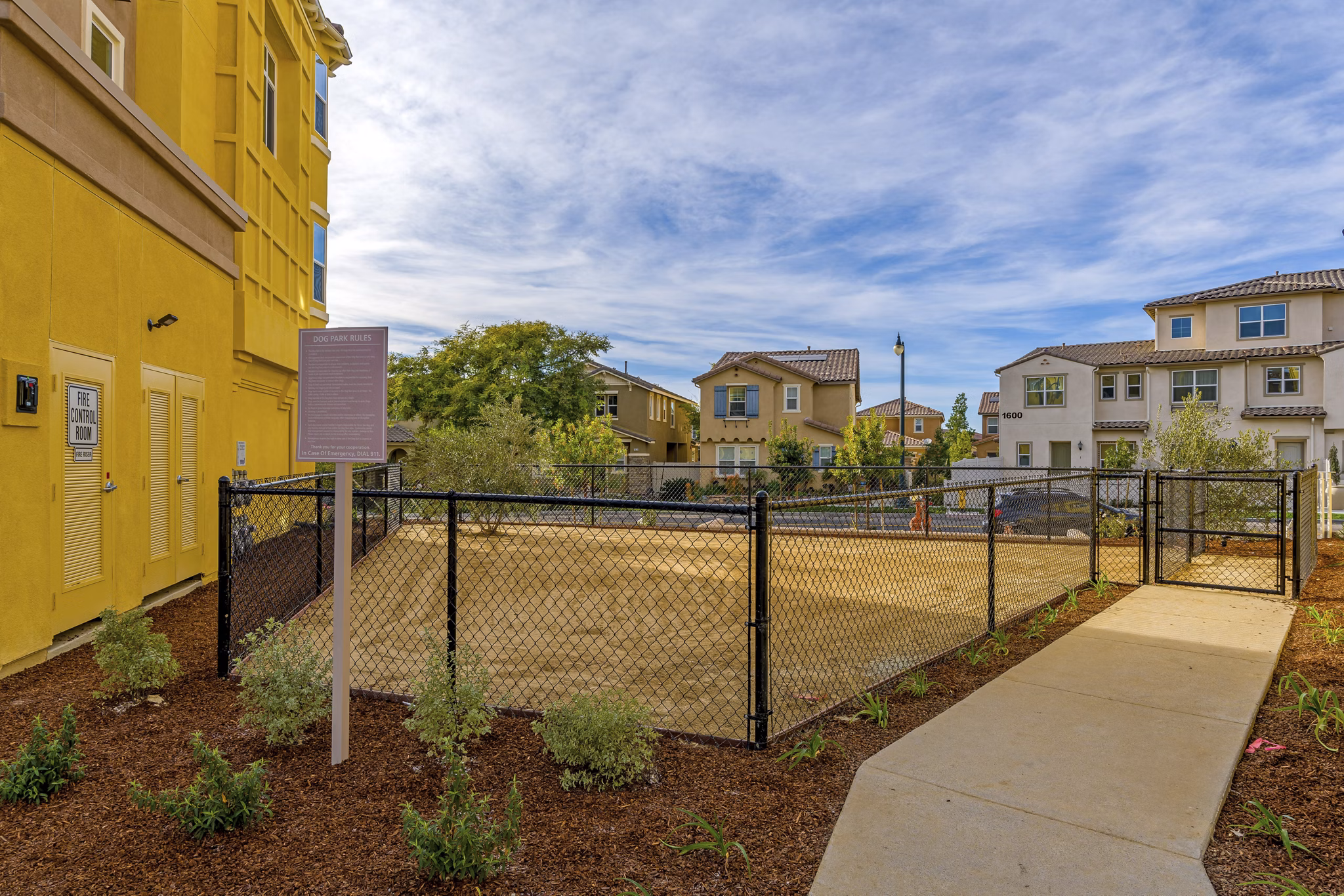 Dog-friendly park featuring agility equipment at Salerno Apartments