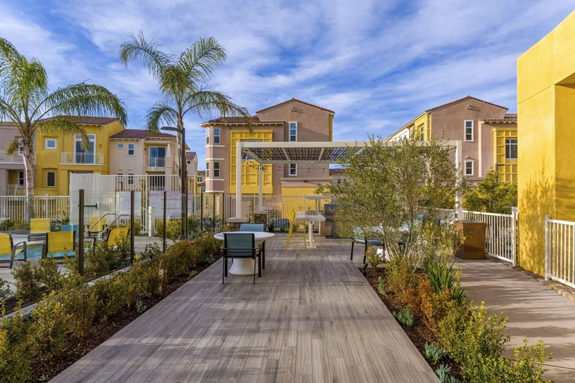 Inviting patio with modern grill area at Salerno Apartments, ideal for outdoor gatherings and relaxation