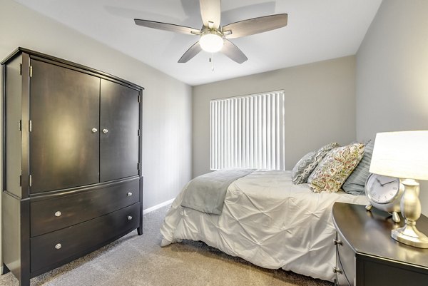 Cozy bedroom with designer furniture at Santee Villas Apartments