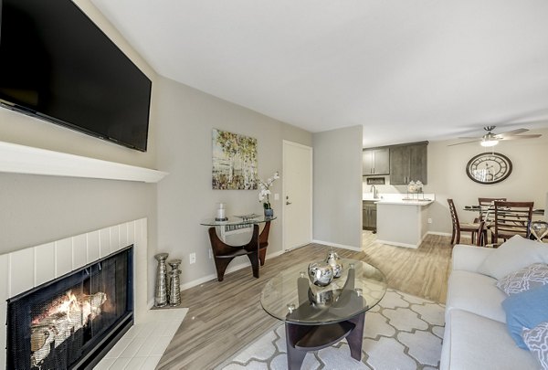 Spacious living room with modern decor and natural light at Santee Villas Apartments