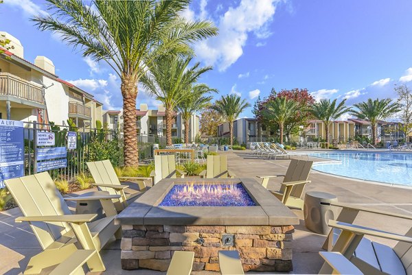 Cozy fire pit and patio area at Santee Villas Apartments, ideal for social gatherings and relaxation in a welcoming outdoor space