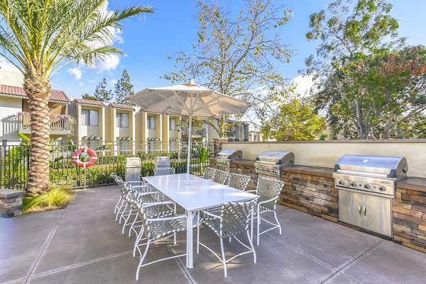 Grill area and patio at Santee Villas Apartments offering outdoor dining space and scenic views