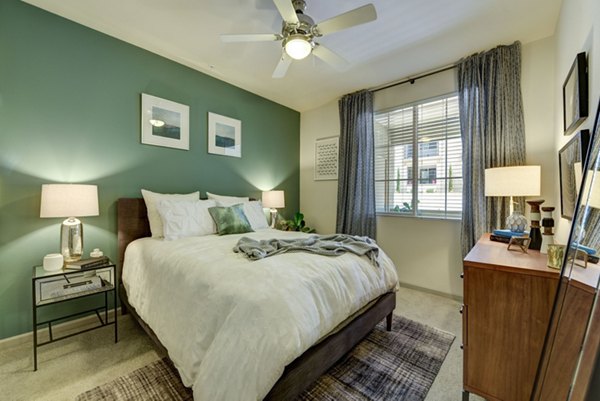Seta Apartments: Modern bedroom with stylish decor in luxury apartment community