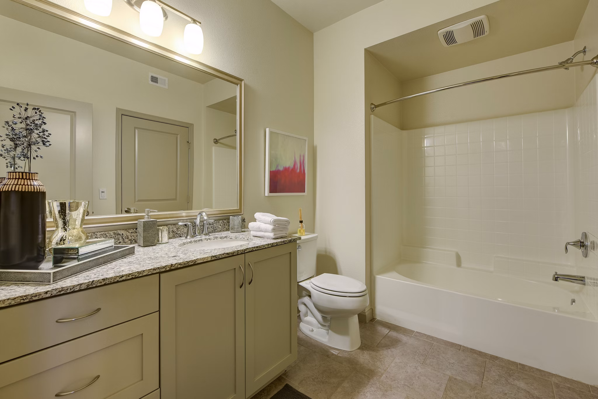 Bathroom with marble countertops and modern fixtures at Seta Apartments luxury community