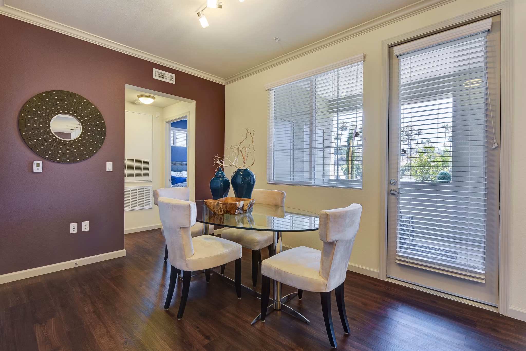 Dining room with elegant lighting and modern furniture at Seta Apartments