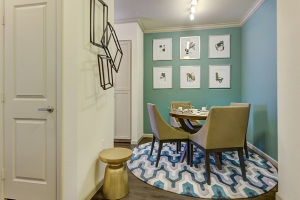 Dining room featuring elegant furnishings and natural light at Seta Apartments