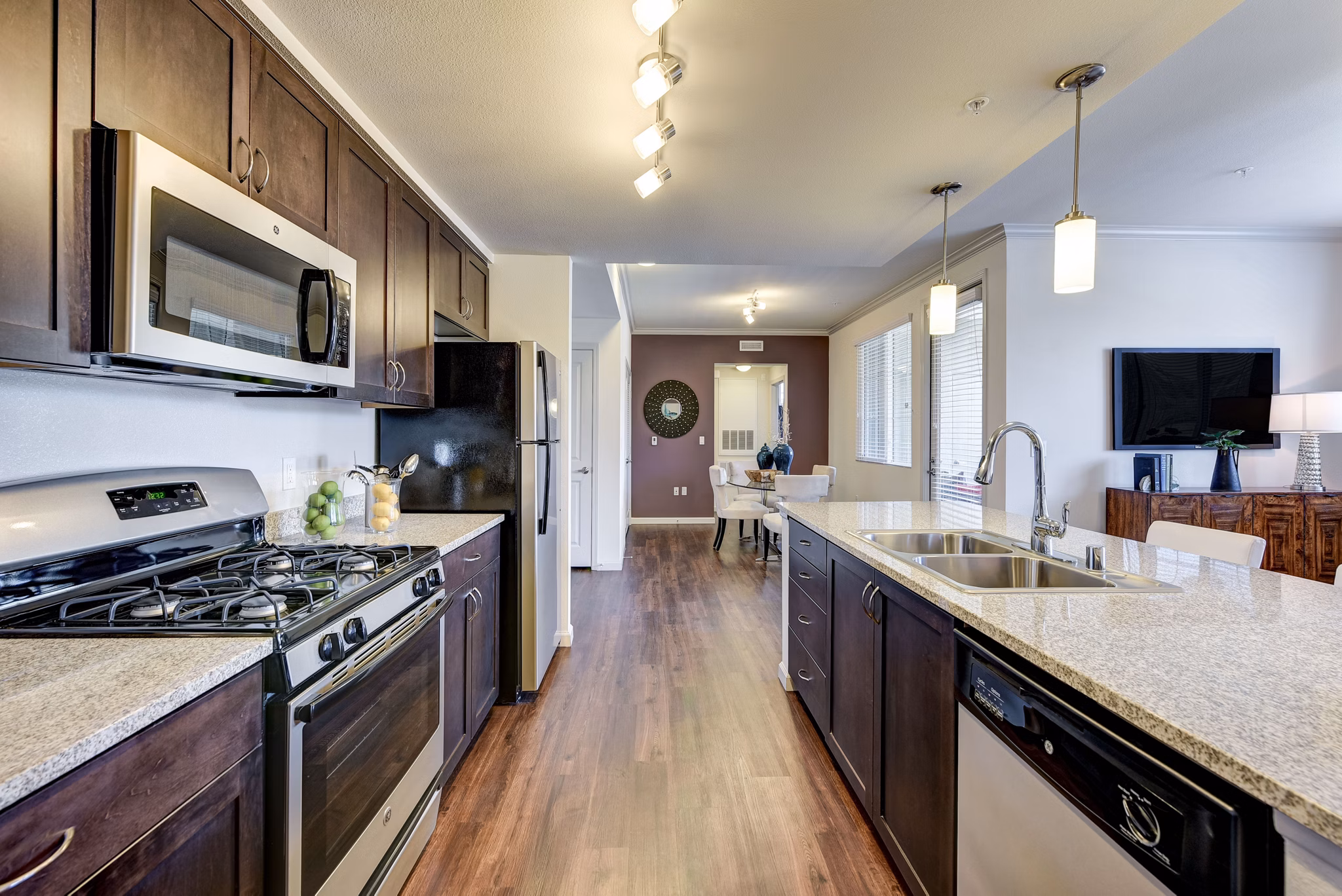 Modern kitchen with stainless steel appliances at Seta Apartments in Luxury Greystar Community