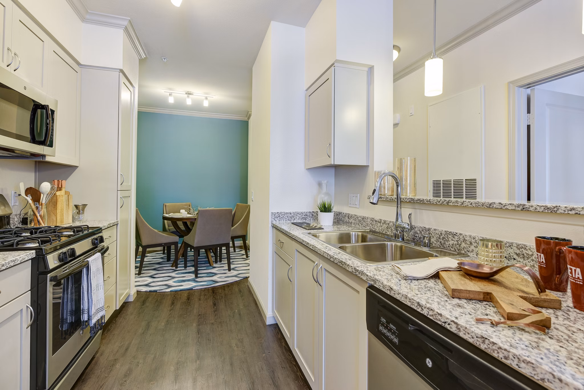 Modern kitchen with stainless steel appliances at Seta Apartments featuring sleek countertops and ample storage space