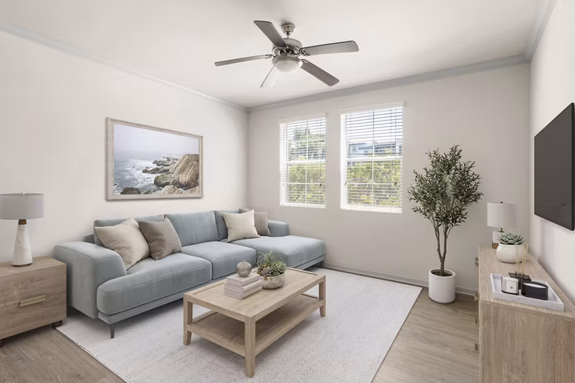 Elegant living room with plush seating and natural light at Seta Apartments, luxury residences by Greystar