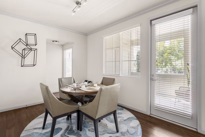 Cozy living room with contemporary dÃ©cor and large windows at Seta Apartments, Greystar luxury apartments in vibrant urban setting