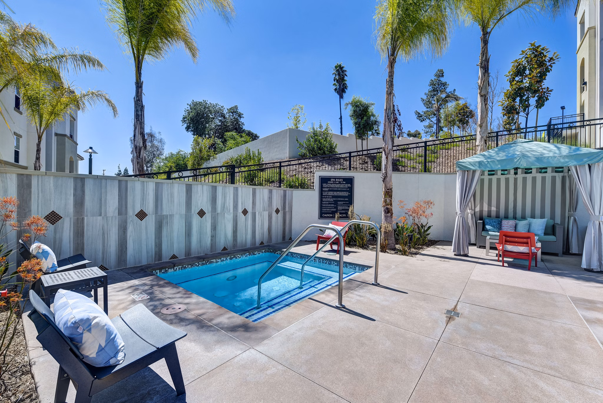 Resort-style pool area with sun loungers at Seta Apartments, luxury living by Greystar