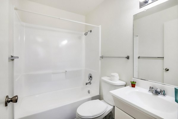 Elegant bathroom with modern fixtures at Softwind Point Apartments, offering luxury living in scenic surroundings