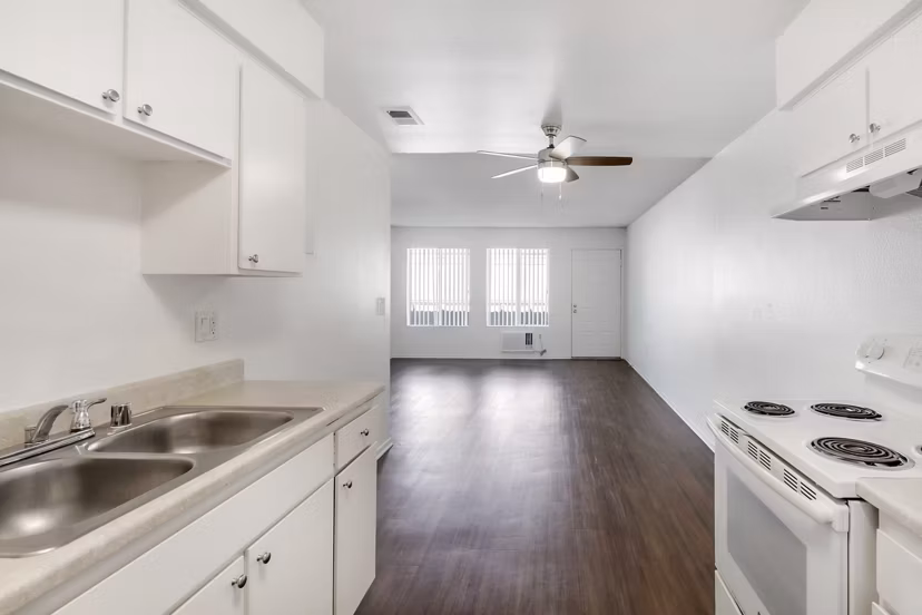 Kitchens with updated appliances and granite countertops at Softwind Point Apartments