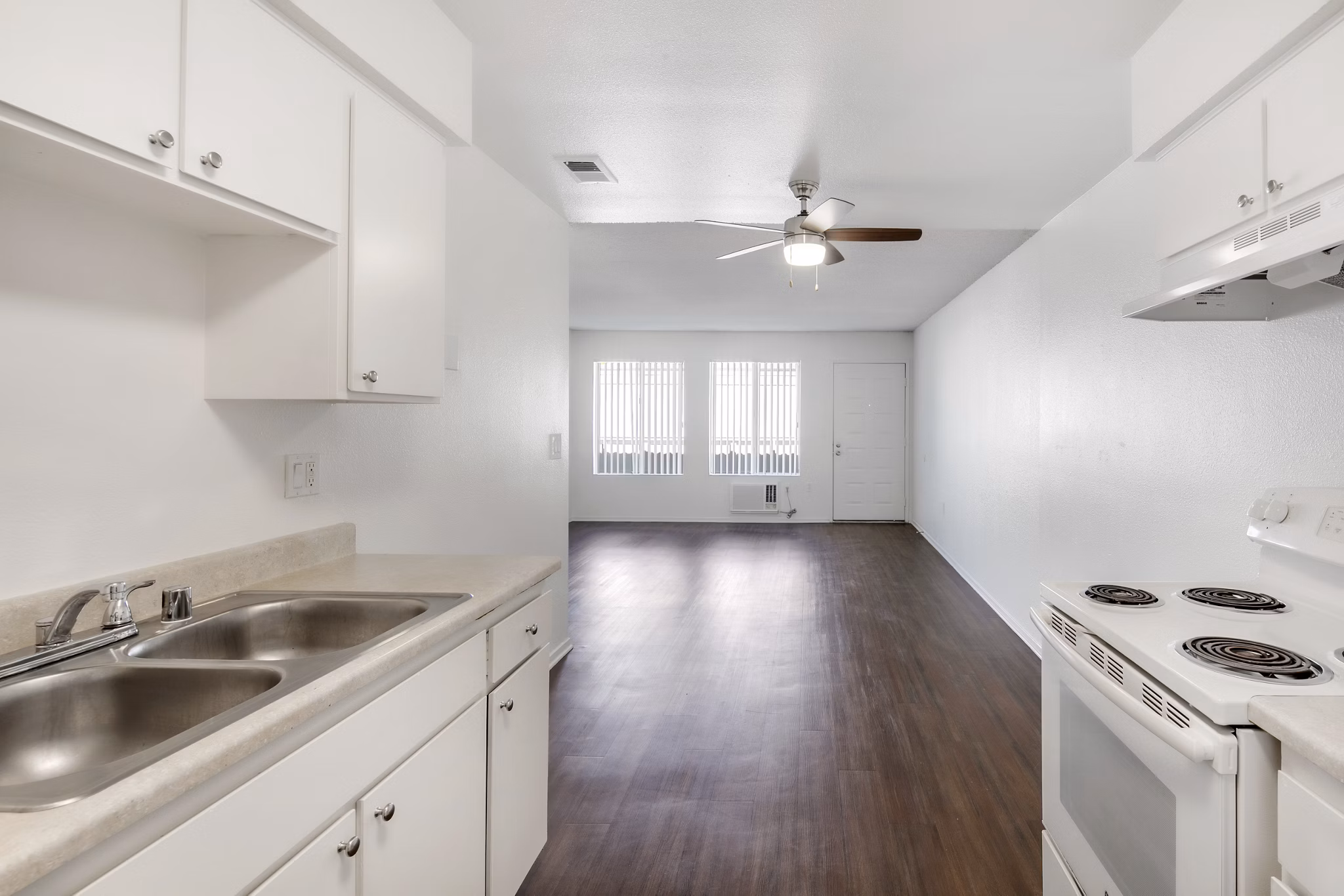Kitchens with updated appliances and granite countertops at Softwind Point Apartments