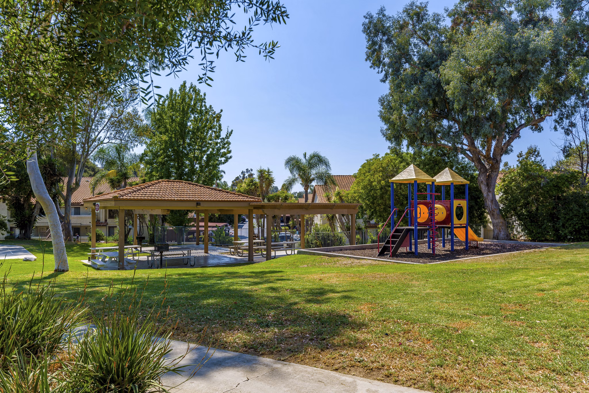 Modern playground with slides and swings at Softwind Point Apartments for family-friendly fun