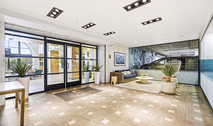Clubhouse lobby with contemporary design and plush seating at Sola at Pacific Highlands Ranch Apartments