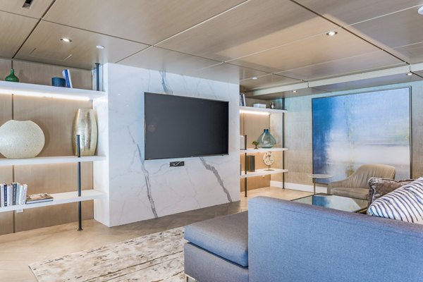 Clubhouse theater with plush seating and large screen at Sola at Pacific Highlands Ranch Apartments