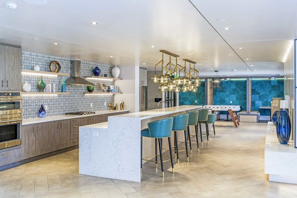 Clubhouse kitchen with stainless steel appliances at Sola at Pacific Highlands Ranch Apartments