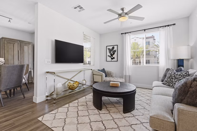 Spacious living room with modern decor in Sola at Pacific Highlands Ranch Apartments