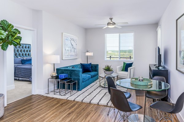 Spacious living room with modern decor in Sola at Pacific Highlands Ranch Apartments