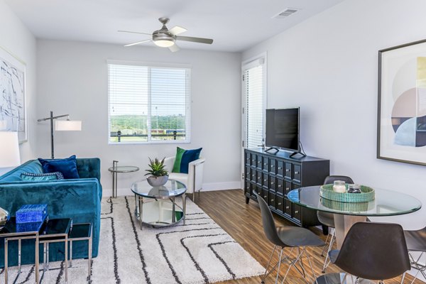 Spacious living room featuring modern furniture at Sola at Pacific Highlands Ranch Apartments