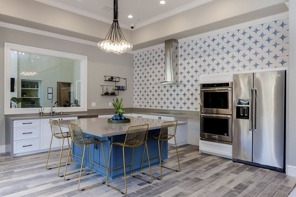 Clubhouse with modern decor and expansive seating at Missions at Sunbow Apartments