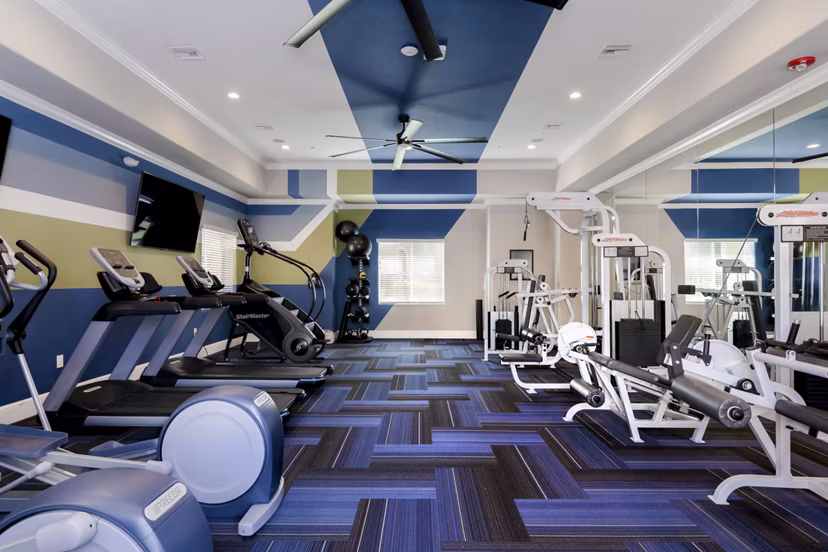 State-of-the-art fitness center at Missions at Sunbow Apartments with modern equipment and ample workout space for residents