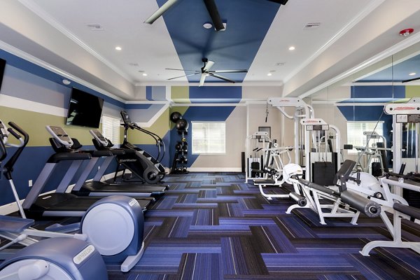 State-of-the-art fitness center at Missions at Sunbow Apartments with modern equipment and ample workout space for residents
