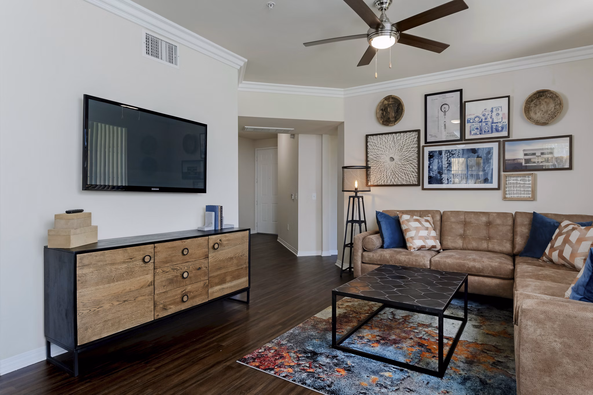 Cozy living room with stylish decor at Missions at Sunbow Apartments, ideal for relaxation and entertainment