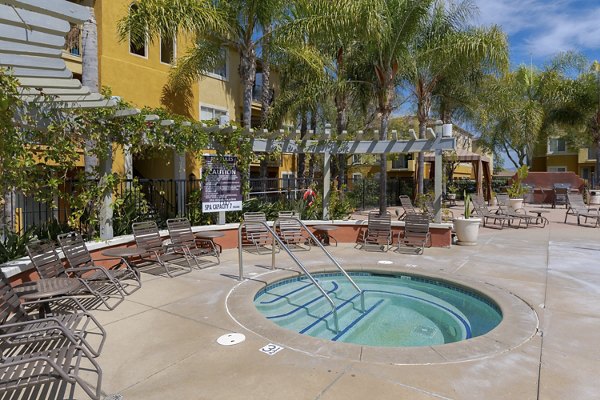 Relaxing hot tub at Missions at Sunbow Apartments with serene ambiance, perfect for unwinding after a long day