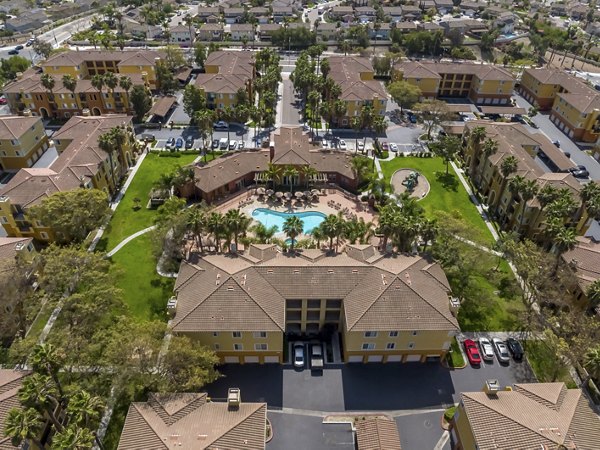 Missions at Sunbow Apartments: Scenic view of luxury apartment in Chula Vista, surrounded by lush landscaping