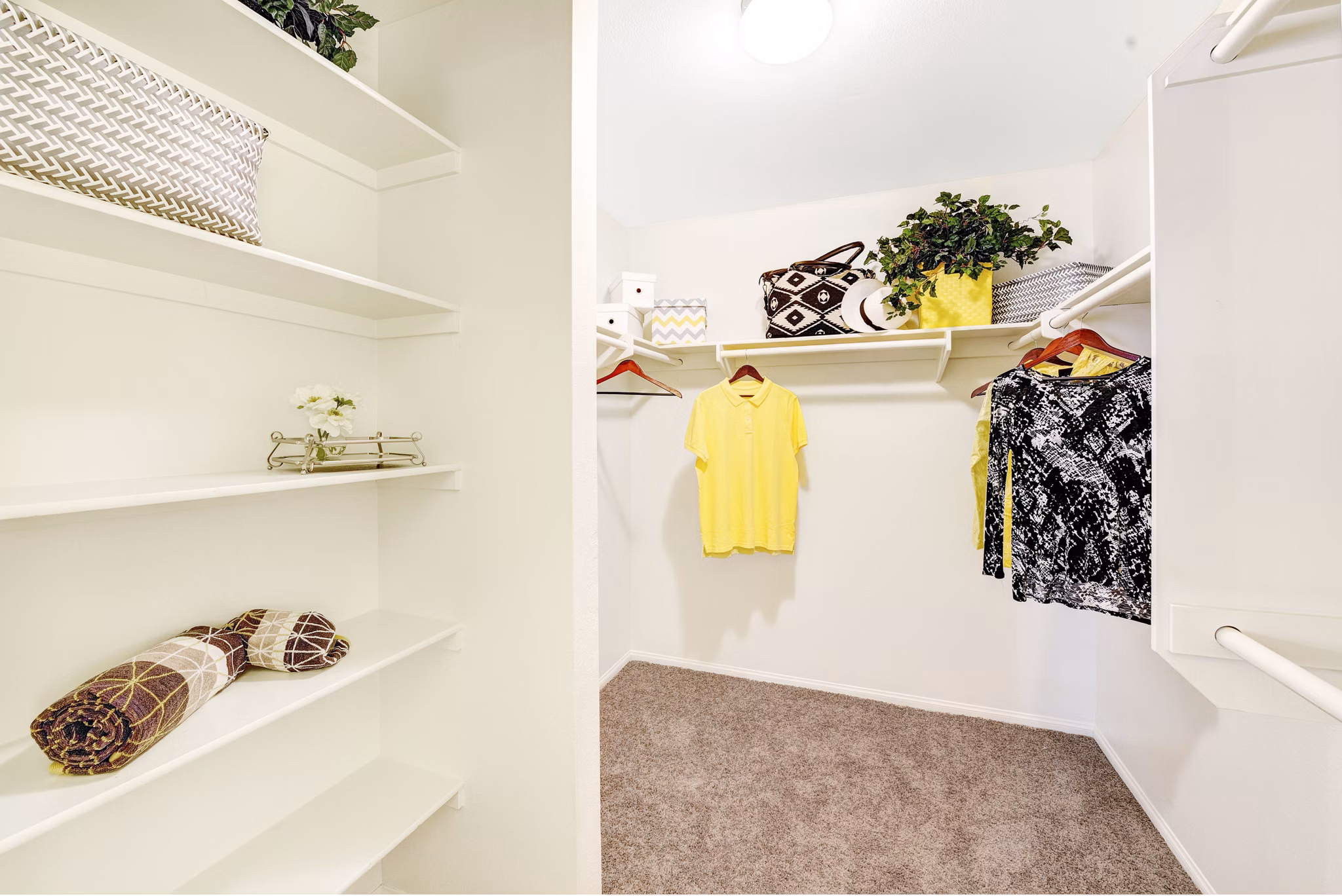Bedroom closet with custom shelving and ample storage in Sunbow Villas Apartments
