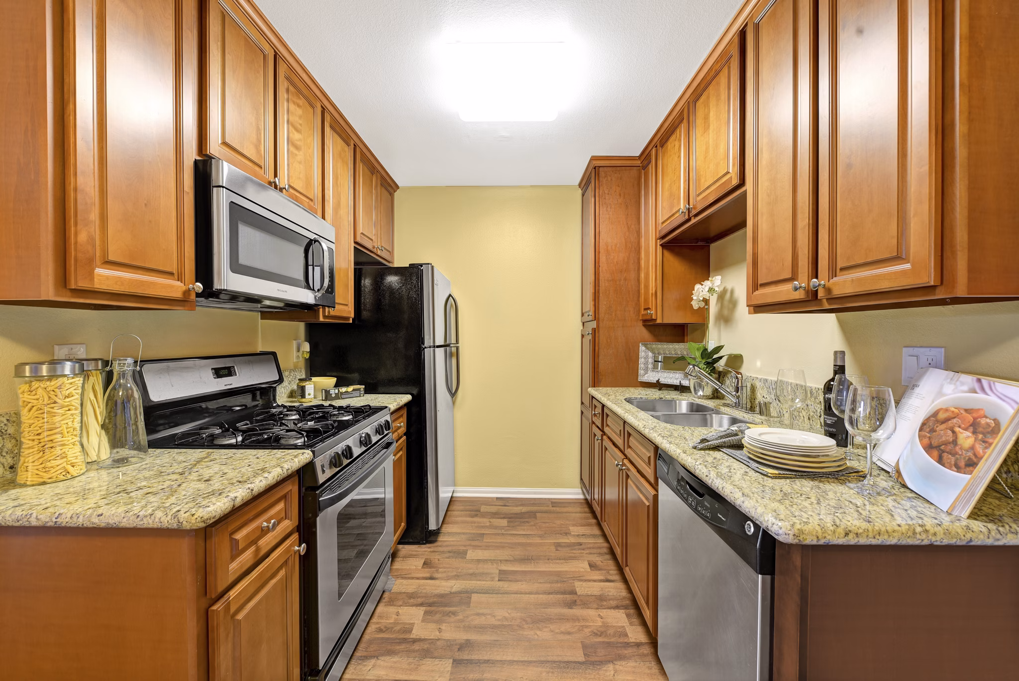 Modern kitchen with stainless steel appliances at Sunbow Villas Apartments