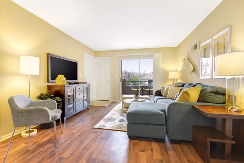 Spacious living room with modern decor in Sunbow Villas Apartments, luxury apartments by Greystar located in a prime area