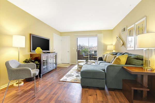 Spacious living room with modern decor in Sunbow Villas Apartments, luxury apartments by Greystar located in a prime area