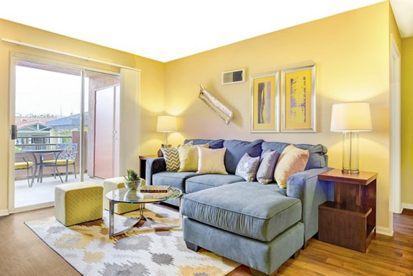 Living room with modern furnishings and open floor plan at Sunbow Villas Apartments