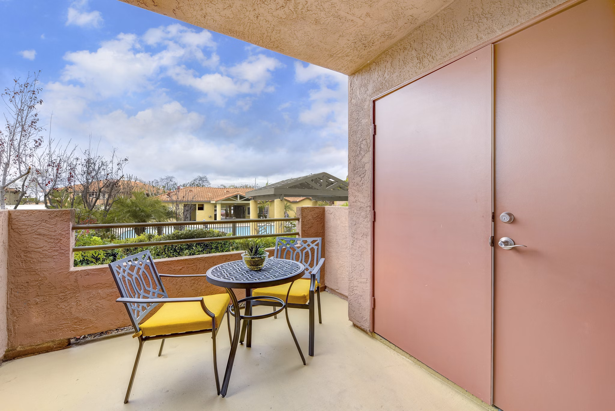 Patio balcony with city views at Sunbow Villas Apartments, a luxury community by Greystar