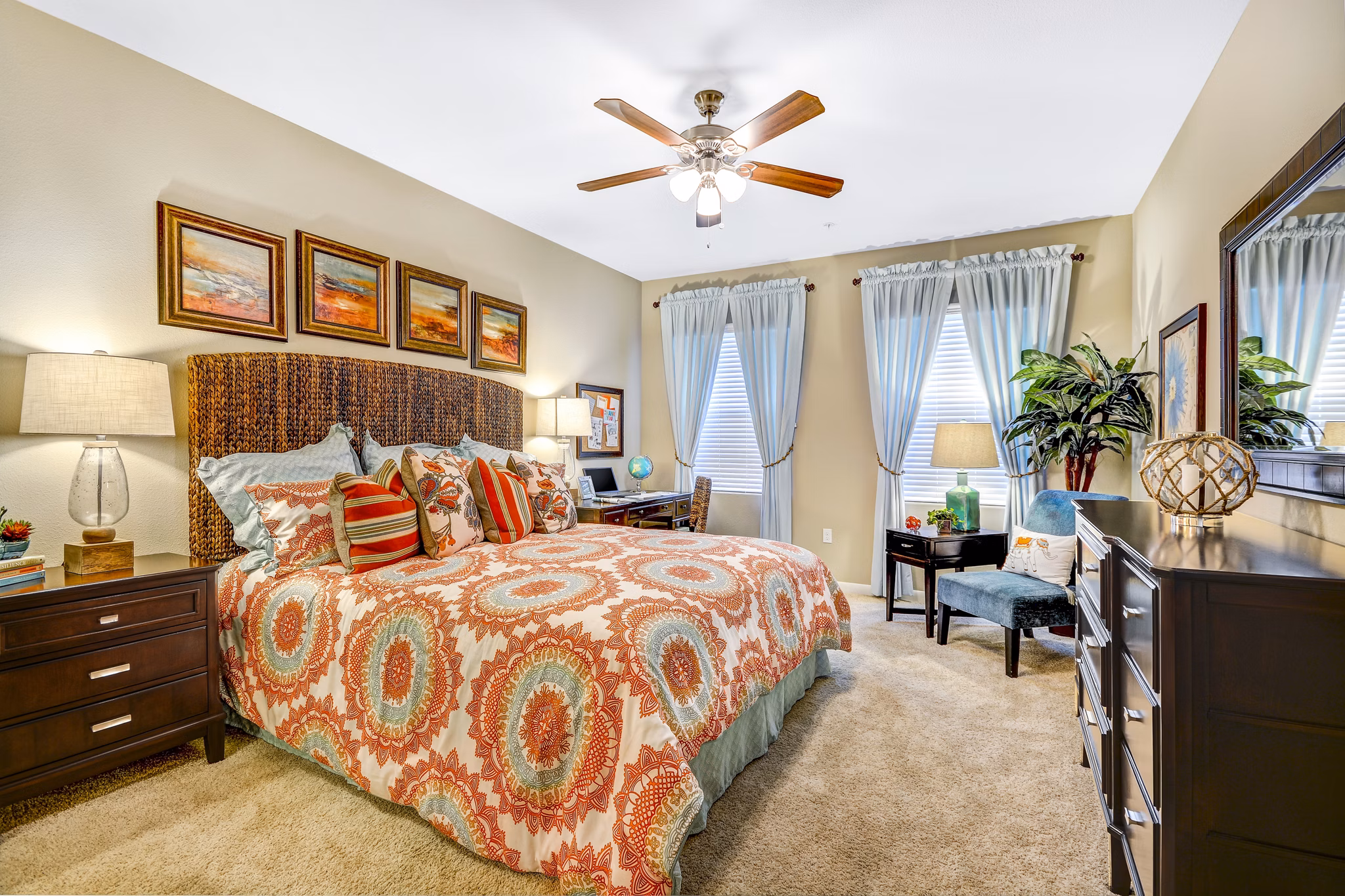 Modern bedroom with elegant decor and ample natural light at Tavera Apartments
