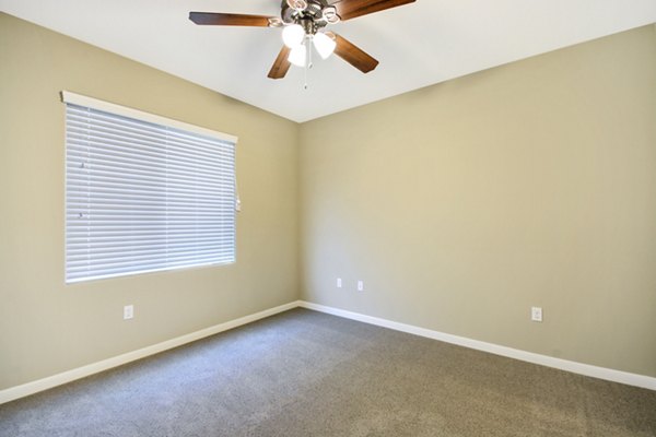 Luxury bedroom with elegant furnishings at Tavera Apartments in San Diego
