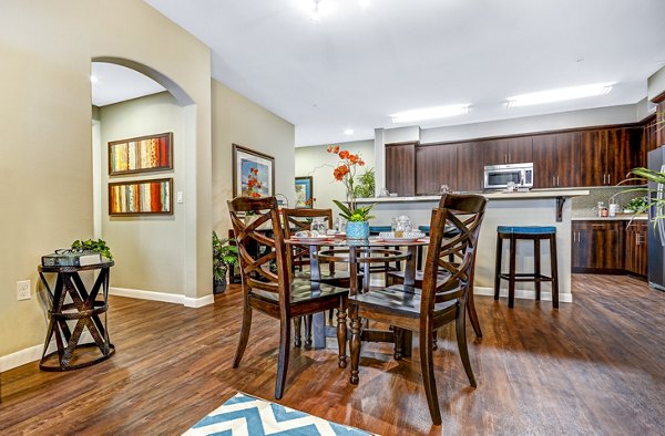 Dining area with modern lighting and sleek furniture in Tavera Apartments, Greystar luxury apartments