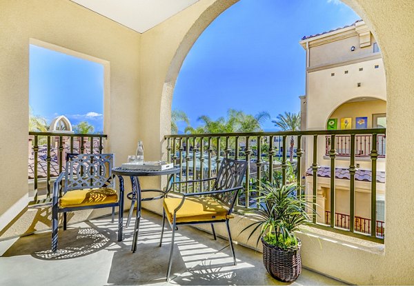 Patio with outdoor seating at Tavera Apartments offering luxury view in sunny California setting
