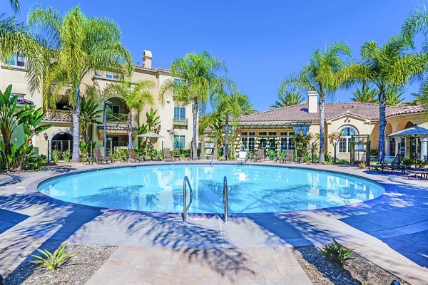 Tavera Apartments: Resort-style pool with sundeck in San Diego, offering luxury amenities for relaxation and leisure